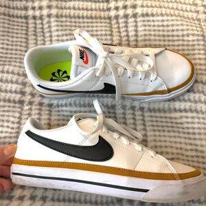 Nike White and Black Sneakers with Gold Trim